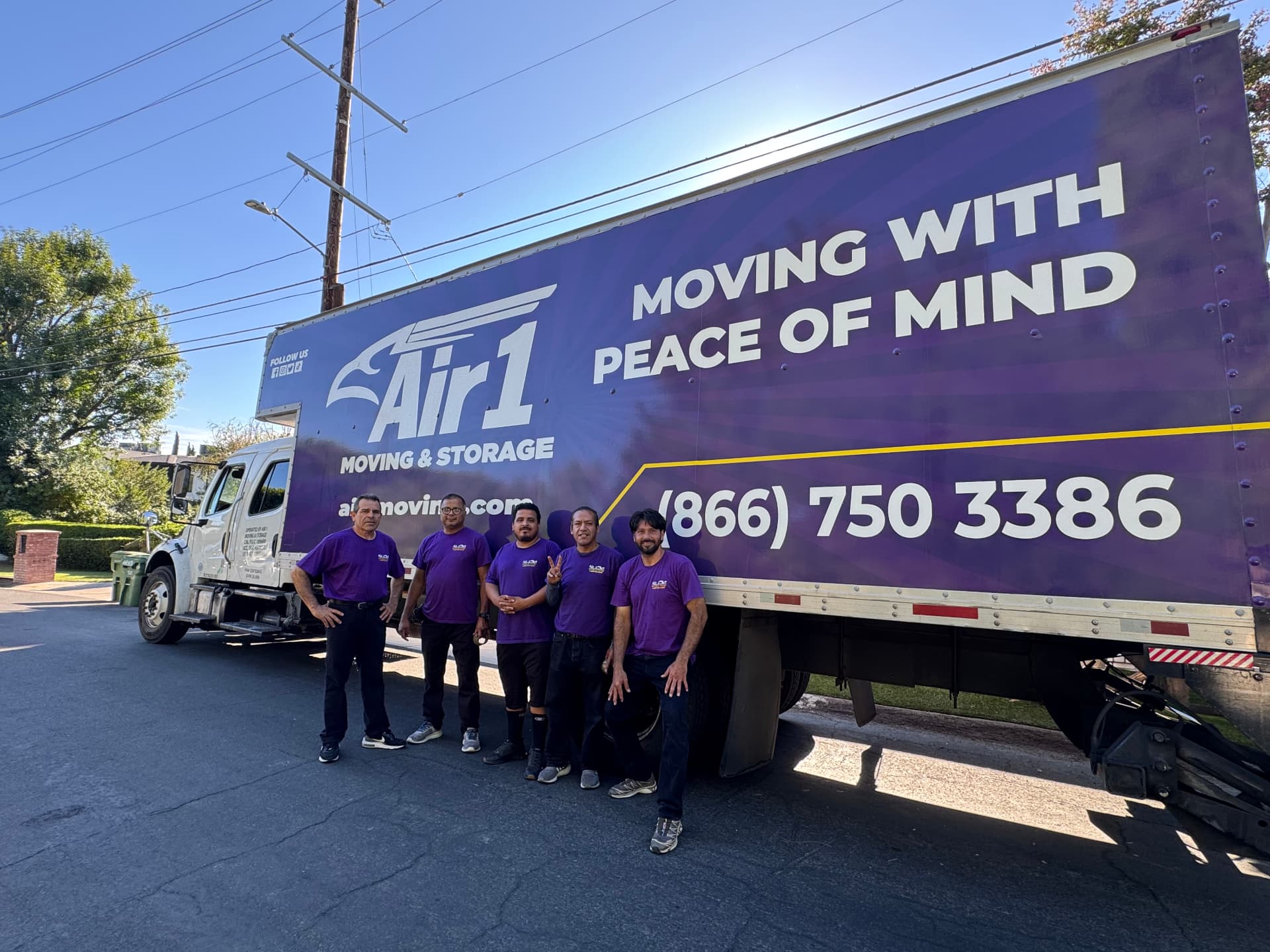 Air1 Moving & Storage professional team standing with branded moving truck