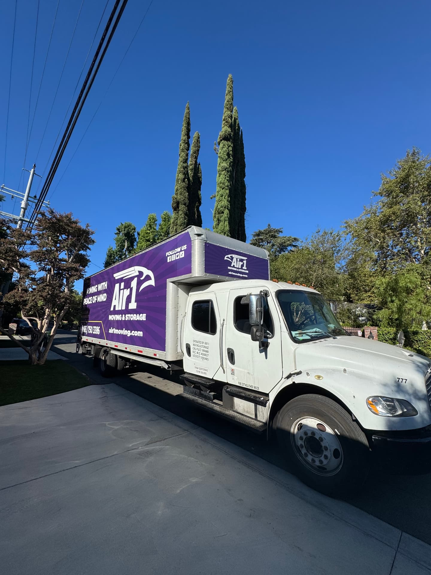 Air1 Moving & Storage truck on residential street ready for long-distance move
